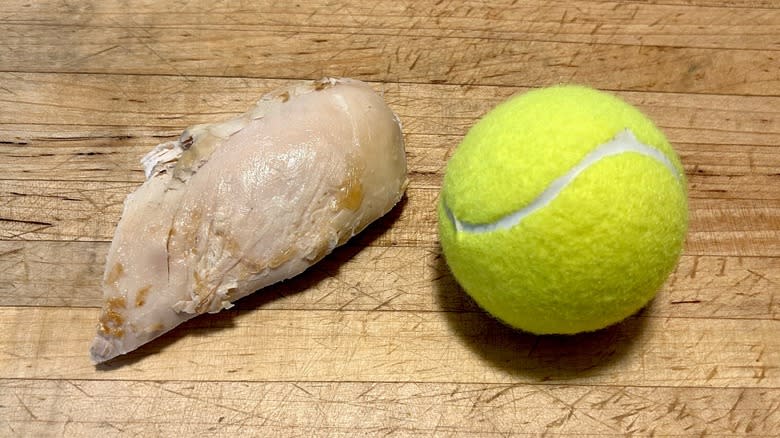 Chicken breast and tennis ball