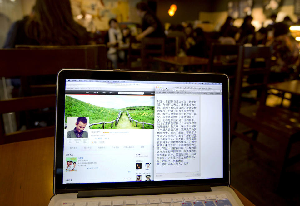 A page from Chinese actor Wen Zhang's Sina Weibo account showing an apology statement to his wife and children posted by him is displayed on a computer screen at a cafe in Beijing, China Wednesday, April 2, 2014. The Chinese actor's apology to his actress wife following rumors of his infidelity has set a record for comments and retweets on China's version of Twitter. (AP Photo/Andy Wong)