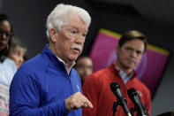 Kansas City Royals owner John Sherman, left, address the media while Kansas City Chiefs president Mark Donovan looks on during a news conference about a plan to extend a sales tax to provide funding to build a new stadium for the Royals and stadium improvement for the Chiefs Saturday, March 30, 2024, at Kauffman Stadium in Kansas City, Mo. Jackson County, Mo. residents will vote on the question Tuesday, April 2. (AP Photo/Charlie Riedel)