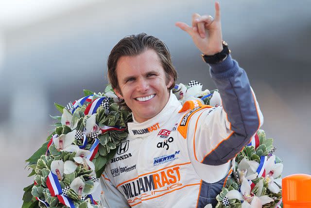 <p>Nick Laham/Getty</p> Dan Wheldon winning the Indy 500 in 2011