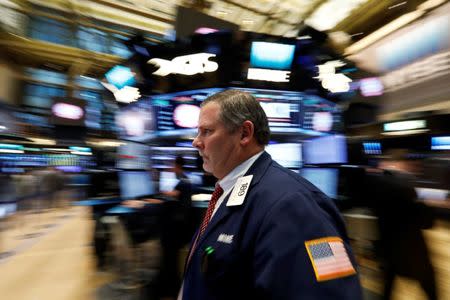 Traders work on the floor of the New York Stock Exchange (NYSE) in New York, U.S., February 7, 2017. REUTERS/Brendan McDermid