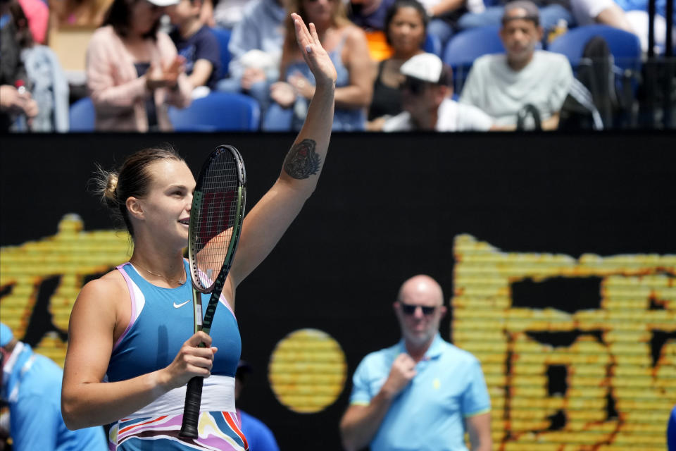 Aryna Sabalenka of Belarus waves after defeating Shelby Rogers of the U.S. in their second round match at the Australian Open tennis championship in Melbourne, Australia, Thursday, Jan. 19, 2023. (AP Photo/Dita Alangkara)