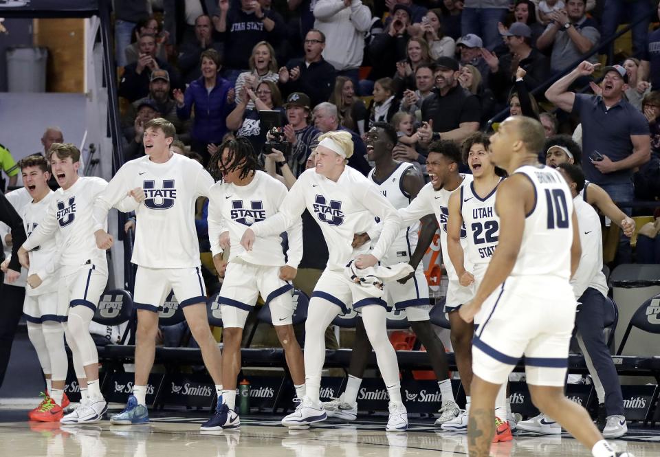 Utah State’s bench erupts following a key basket during the Aggies’ win over No. 13 Colorado State Jan. 6 at the Spectrum in Logan. | Jeff Hunter