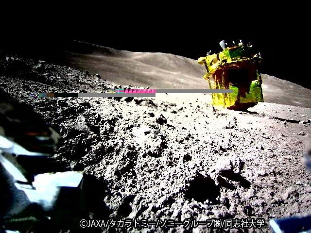 moon surface grey rocky slope with yellow space probe balanced on its nose