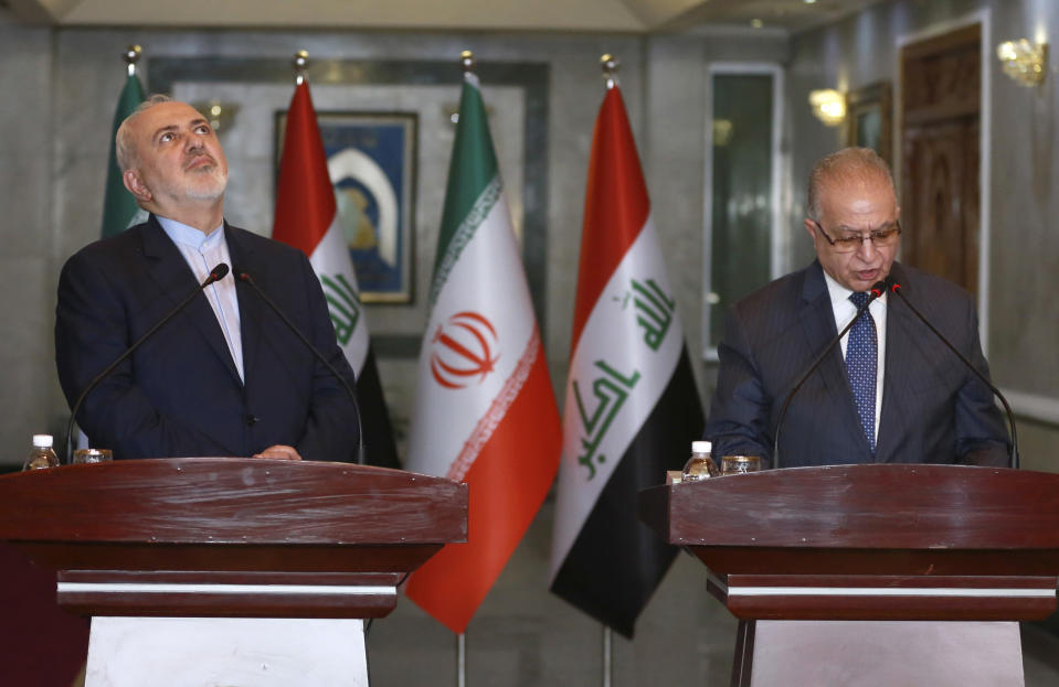 CORRECTS SPELLING OF IRAQI FOREIGN MINISTER TO MOHAMED ALHAKIM - Iraqi Foreign Minister Mohamed Alhakim, right, and Iranian Foreign Minister Mohammad Javad Zarif, hold a press conference in Baghdad, Iraq, Sunday, Jan. 13, 2019. (AP Photo/Khalid Mohammed)