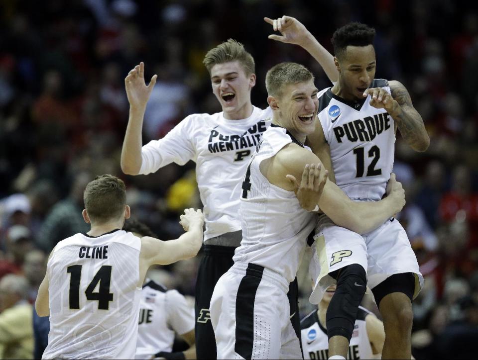 Purdue players celebrates after defeating Iowa State 80-76 in an NCAA college basketball tournament second-round game Saturday, March 18, 2017, in Milwaukee. (AP Photo/Kiichiro Sato)