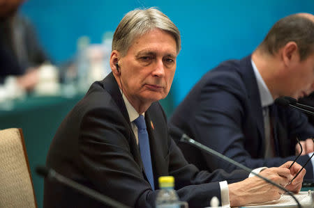 Britain's Chancellor of the Exchequer Philip Hammond attends the UK-China Economic Financial Dialogue at the Diaoyutai State Guesthouse in Beijing, China December 16, 2017. REUTERS/Fred Dufour/Pool