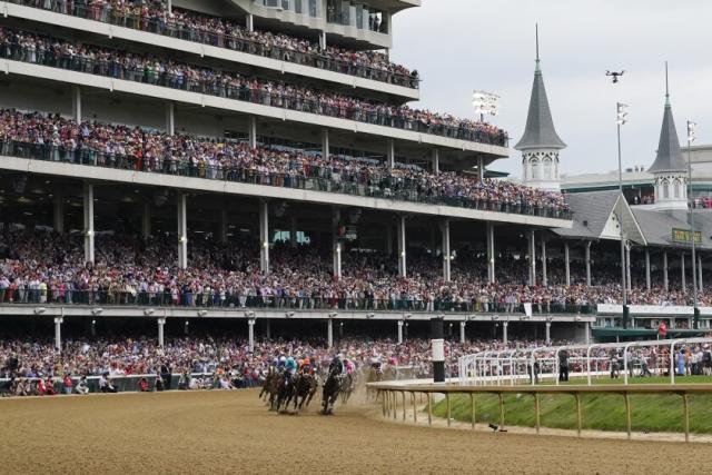 Horses make the first turn as they compete during the Kentucky Derby on May 6, 2023, in Louisville.