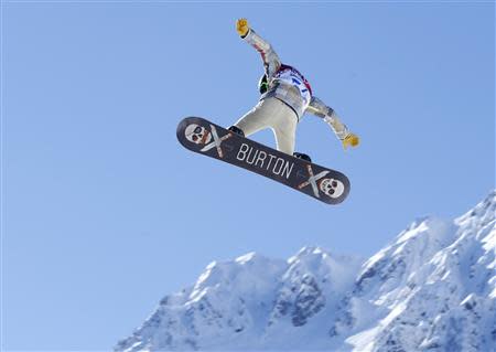 U.S. snowboarder Shaun White takes some air off a jump during a slopestyle snowboard training at the 2014 Sochi Winter Olympics in Rosa Khutor February 3, 2014. REUTERS/Mike Blake