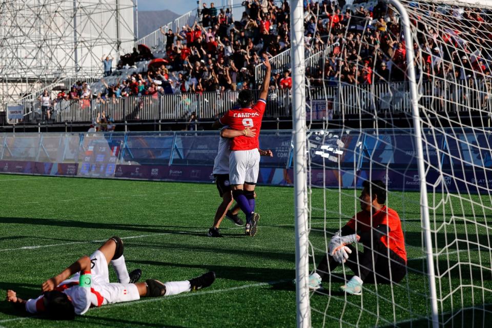 Chile's Esteban Campos, centre, celebrates after scoring during a blind football match against Peru at the ParaPan American Games in Santiago, Chile. (AFP via Getty Images - image credit)