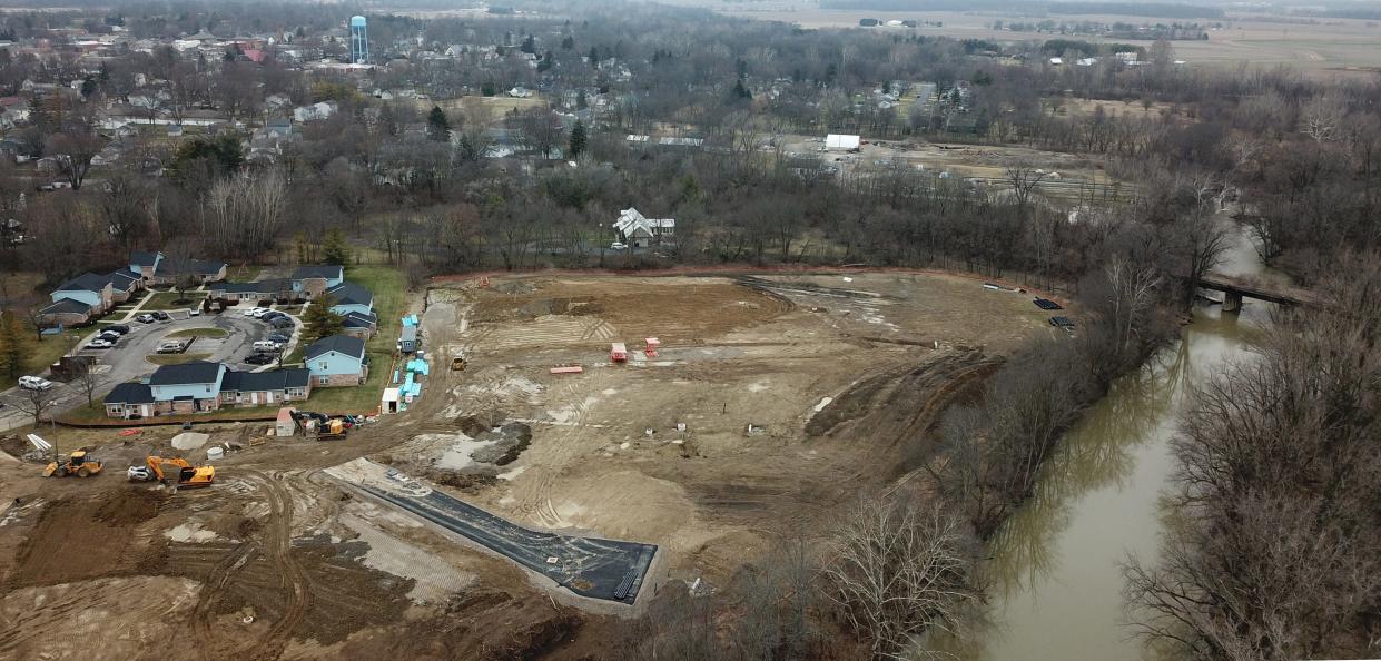 United Church Homes is now building "The Hamlet on Darby" housing development, seen here in a Jan. 18 aerial photo, next to the Big Darby Creek in Plain City, where officials are proposing a new sewage treatment plant. The new plant and a regional wastewater treatment plant and sewage systems planned in Madison and Logan counties have environmentalists worried that they will lead to major development and will make things even worse for the health of wildlife in the Big Darby watershed.