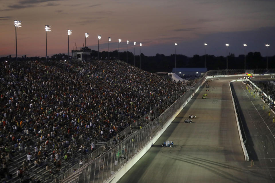 Josef Newgarden, bottom, leads early during the IndyCar auto race at World Wide Technology Raceway on Saturday, Aug. 24, 2019, in Madison, Ill. (AP Photo/Jeff Roberson)