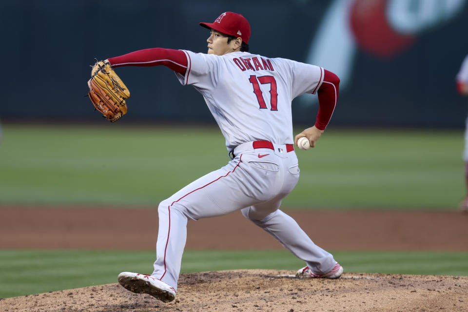 Los Angeles Angels starting pitcher Shohei Ohtani throws to an Oakland Athletics batter during the third inning of a baseball game in Oakland, Calif., Tuesday, Aug. 9, 2022. (AP Photo/Jed Jacobsohn)