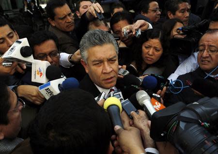 David Penchyna, leader of the Senate's energy committee and member of ruling Institutional Revolutionary Party (PRI), speaks to the media before a debate on an energy reform bill at the Senate in Mexico City December 10, 2013. REUTERS/Henry Romero