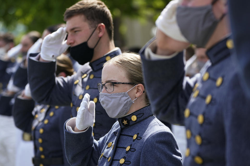 Virginia Military Institute class of 2021 salute the flag during a change of command parade and ceremony on the parade grounds at the school in Lexington, Va., Friday, May 14, 2021. Kasey Meredith was installed as the first female to lead the Virginia Military Institute's Corps of Cadets in its 182 year history. (AP Photo/Steve Helber)