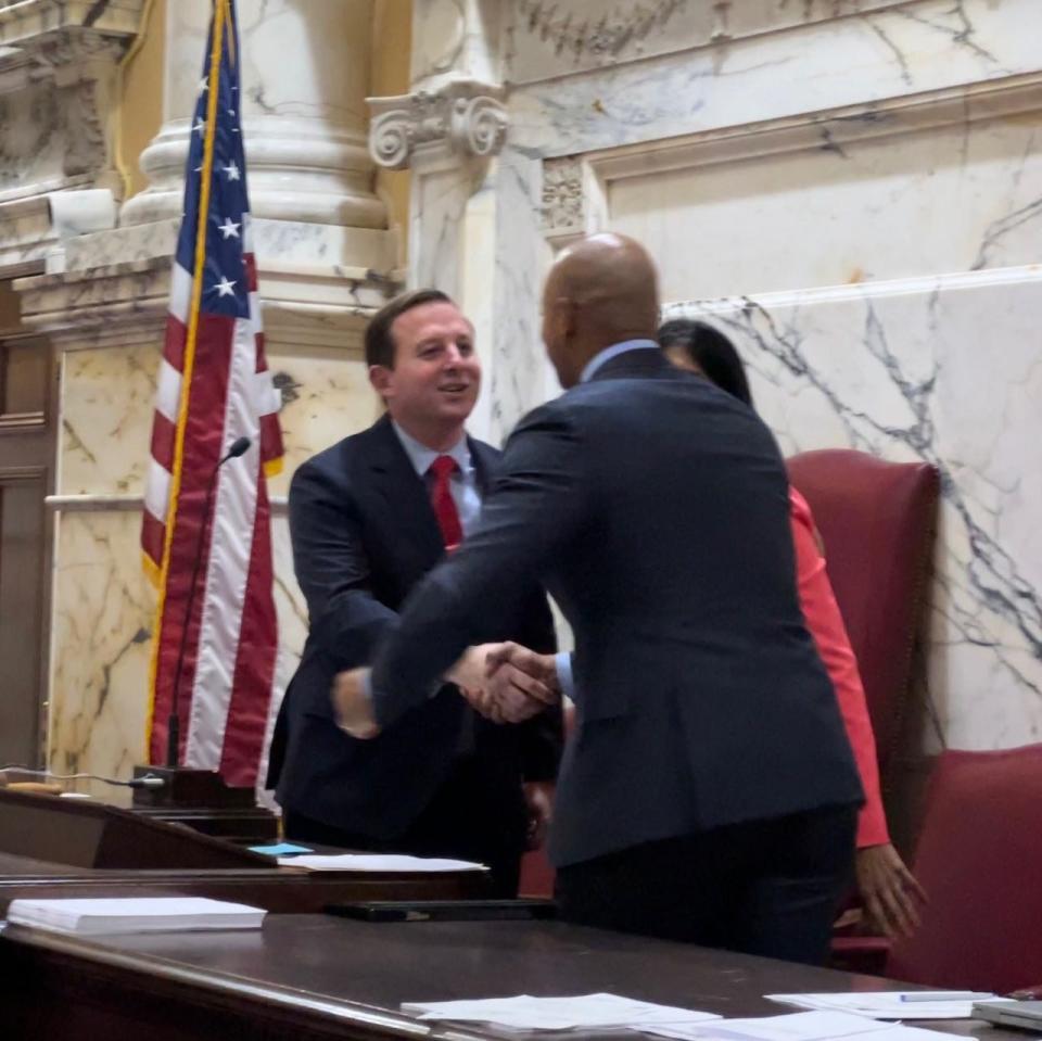 Senate President Bill Ferguson, D-Baltimore City, shakes hands with new Gov. Wes Moore on the last day of the General Assembly session in Annapolis, Maryland on April 10, 2023.