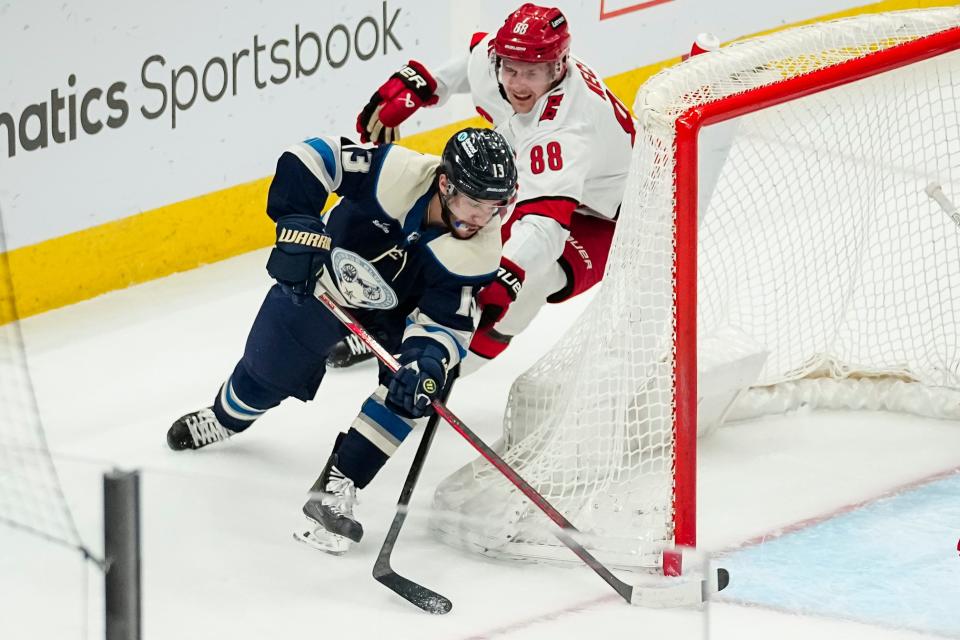 Apr 16, 2024; Columbus, Ohio, USA; Columbus Blue Jackets left wing Johnny Gaudreau (13) scores a wraparound goal past Carolina Hurricanes center Martin Necas (88) during the second period of the NHL hockey game at Nationwide Arena.