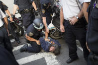 Anna Roblin is arrested during an Occupy Wall Street march, Monday, Sept. 17, 2012, in New York. A handful of Occupy Wall Street protestors were arrested during a march toward the New York Stock Exchange on the anniversary of the grass-roots movement. (AP Photo/John Minchillo)
