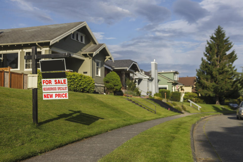 A for sale sign in front of a home in a Bellingham neighborhood.