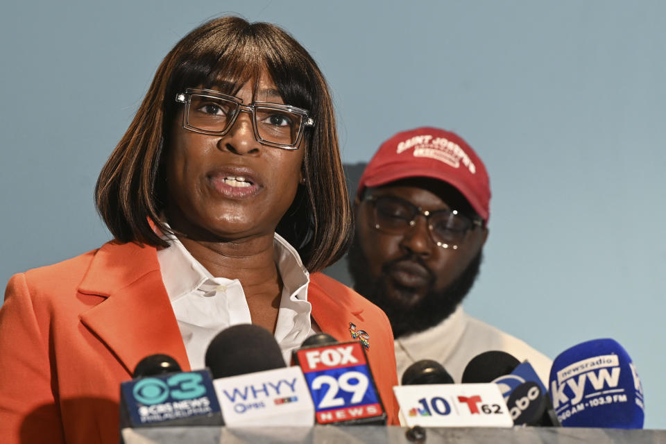 From left, Celena Morrison-McLean and Darius McLean hold a news conference on Thursday, March 7, 2024 in Philadelphia. The Philadelphia city official was arrested over the weekend during a traffic stop and started recording the incident because she feared for her husband's life as a trooper handcuffed him on a rainy elevated highway. (Tom Gralish/The Philadelphia Inquirer via AP)