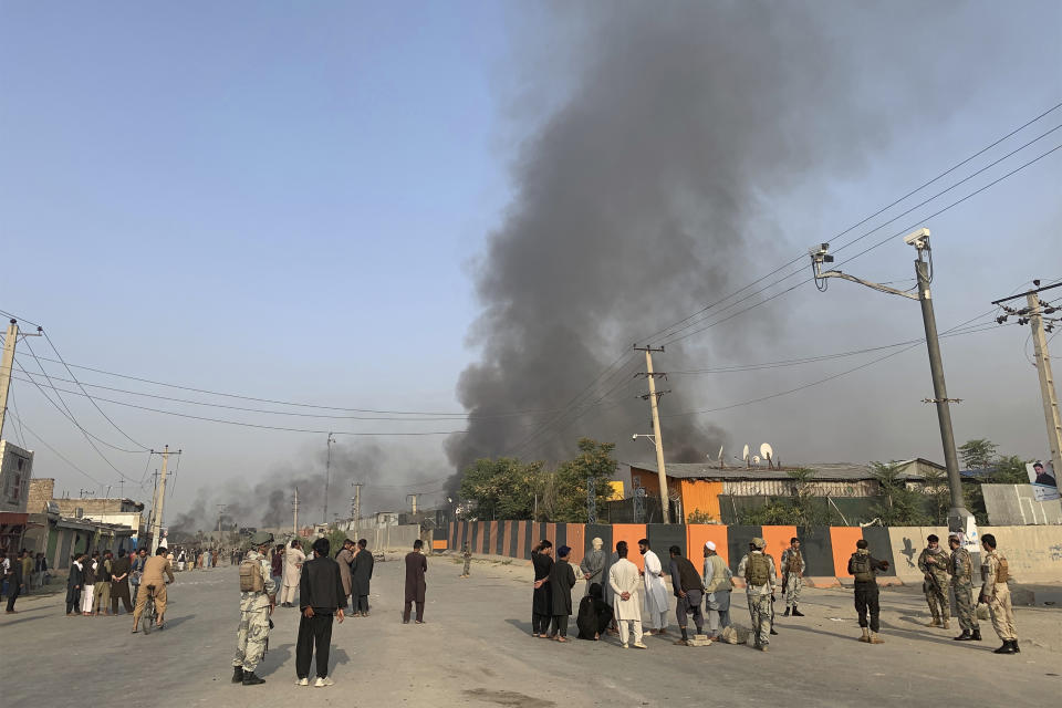 Smoke billows from the Green Village, home to several international organizations and guesthouses, in Kabul, Afghanistan, Tuesday, Sept. 3, 2019. Angry residents climbed into the international compound that had been targeted and set part of it on fire. (AP Photo/Rahmat Gul)