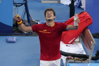 Pablo Carreno Busta, of Spain, celebrates after defeating Novak Djokovic, of Serbia, in the bronze medal match of the tennis competition at the 2020 Summer Olympics, Saturday, July 31, 2021, in Tokyo, Japan. (AP Photo/Seth Wenig)