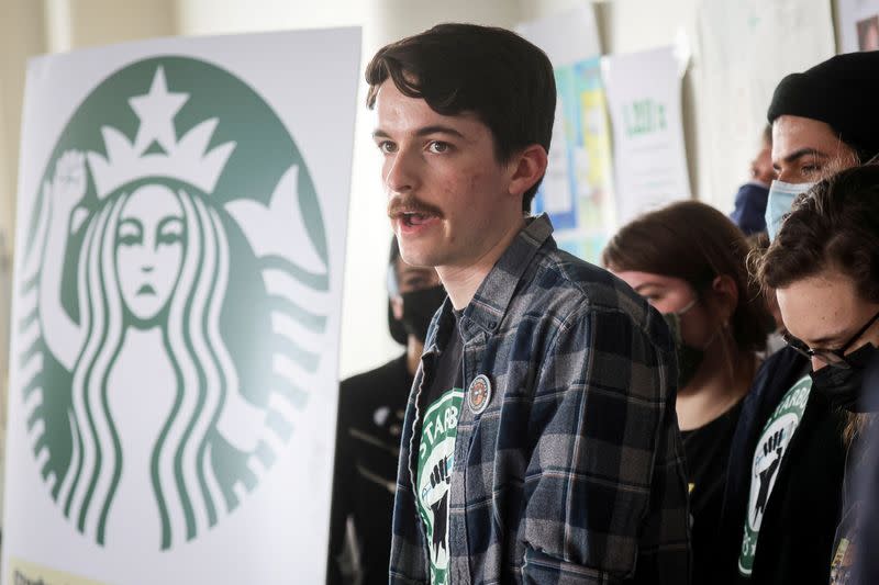 FILE PHOTO: Starbucks workers react during a news conference to a decision by the National Labor Relations Board to postpone a scheduled union vote count in Buffalo, New York