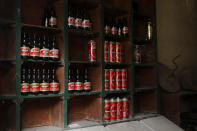 <p>Empty beer cans and bottles sit on shelves inside an abandoned shop in the village of Papratna, near the southeastern town of Knjazevac, Serbia, Aug. 14, 2017. (Photo: Marko Djurica/Reuters) </p>