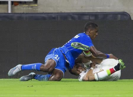 Jul 1, 2015; Houston, TX, USA; Mexico forward Javier Hernandez (right) collides with Honduras defender Brayan Beckeles (21) and injures himself during the first half at NRG Stadium. Mandatory Credit: Kevin Jairaj-USA TODAY Sports