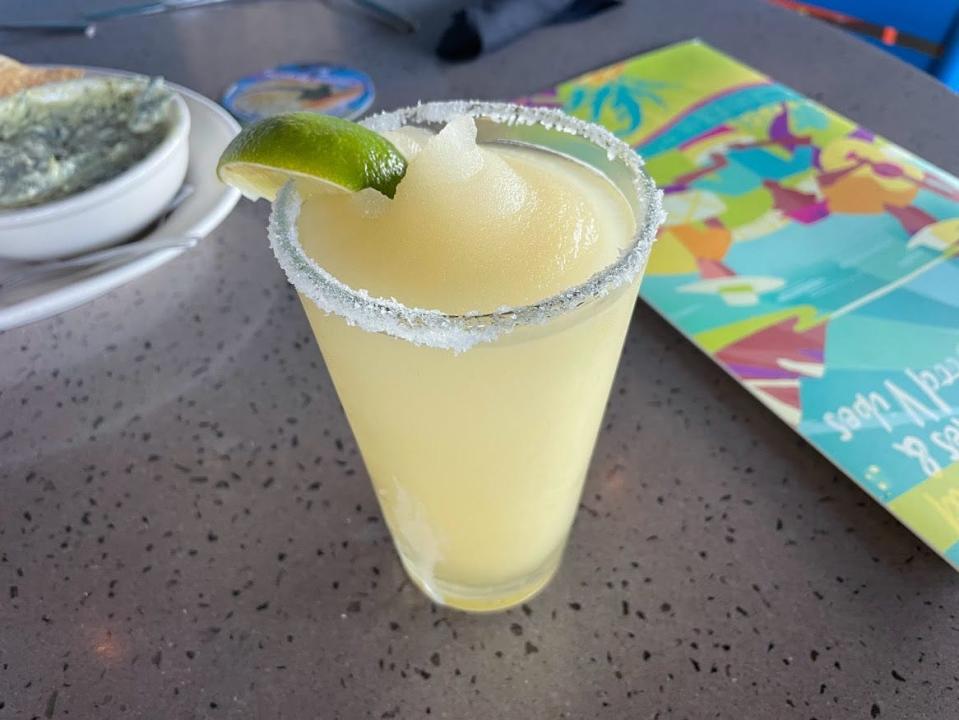 Frosty Margarita in glass with lime wedge at Bahama Breeze