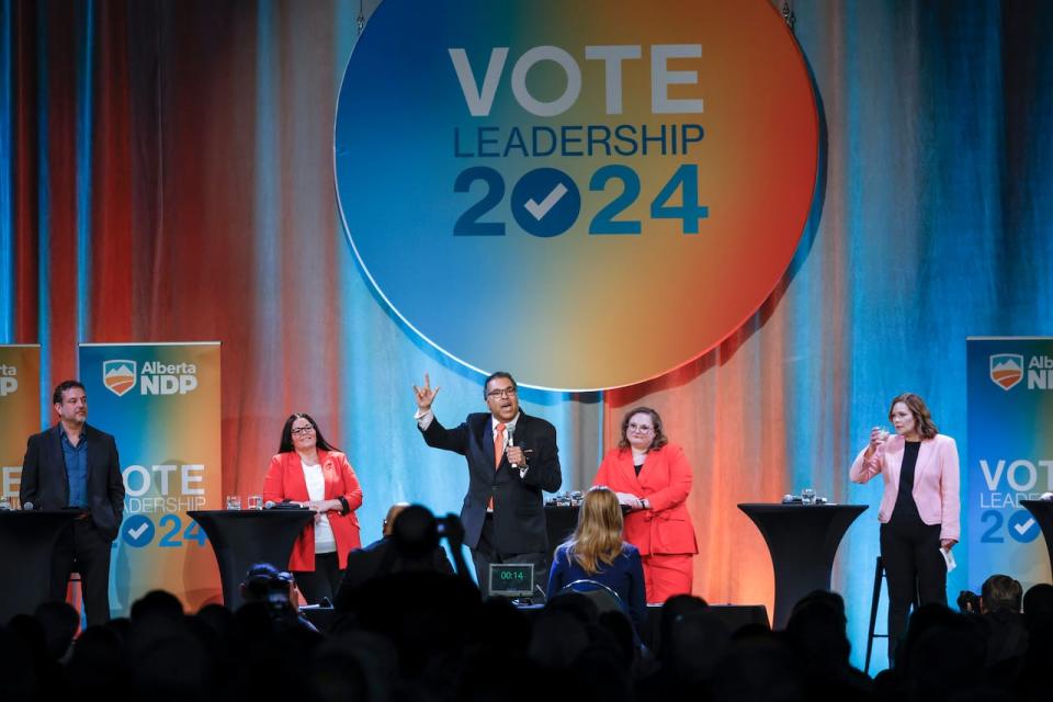 Alberta NDP leadership candidates stand on stage during a leadership debate in Calgary on May 11. Results of the leadership race are to be announced June 22.
