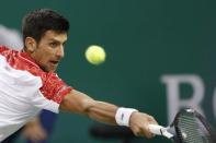 Tennis - Shanghai Masters - Men's Singles - Final - Qi Zhong Tennis Center, Shanghai, China - October 14, 2018. Novak Djokovic of Serbia in action against Borna Coric of Croatia. REUTERS/Aly Song