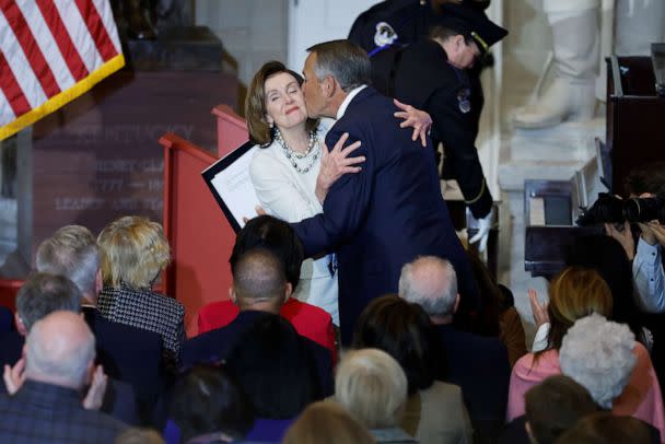 PHOTO: Speaker of the House Nancy Pelosi (D-CA) gets a kiss from former Speaker John Boehner of Ohio during her portrait unveiling ceremony in Statuary Hall at the U.S. Capitol on Dec. 14, 2022 in Washington, DC. (Chip Somodevilla/Getty Images)