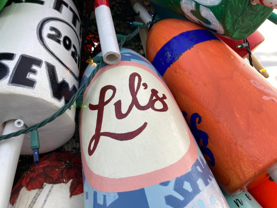 A lobster buoy bought and decorated by Kittery business Lil's Cafe on the town's first holiday lobster buoy tree, as seen Tuesday, Dec. 1, 2021.