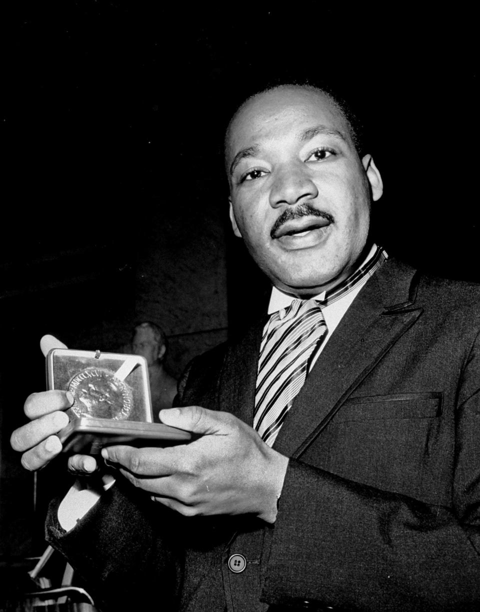 The Rev. Martin Luther King Jr. accepts his Nobel Peace Prize medal in Oslo, Norway, in 1964.