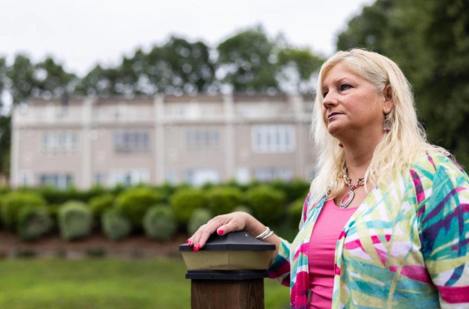 Sherry Loeffler poses for a portrait near her townhouse at Lake Wylie. She has been mired in a lengthy court fight after her HOA hit her with nearly $12,000 in fines - over windows that she says they approved. “I want other homeowners to know this can happen to them,” she said. “And if they don’t have the money to fight it, they could lose their homes.”