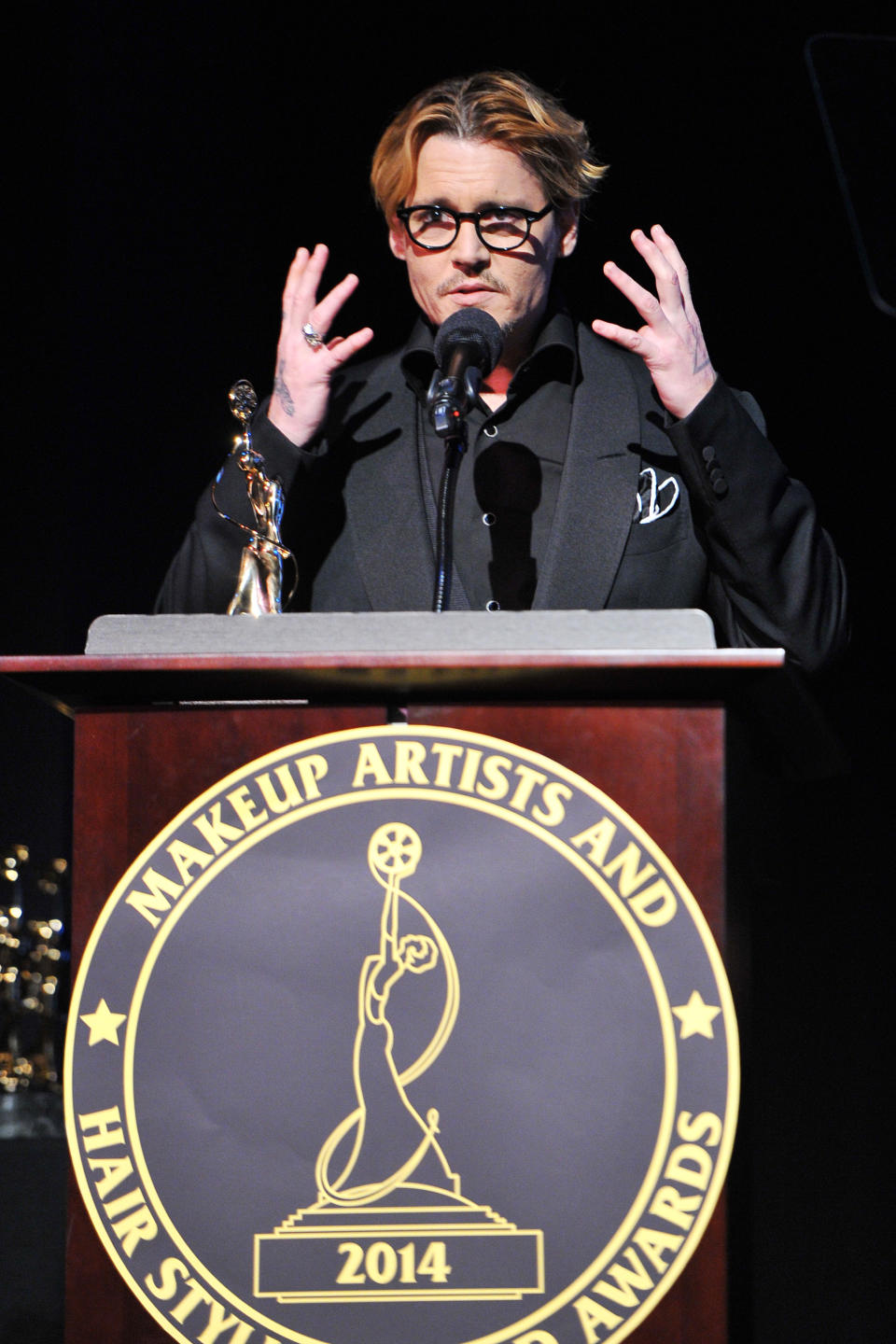 Actor Johnny Depp speaks after accepting the Distinguished Artisan Award at The Make-Up Artists and Hair Stylists Guild Awards on Saturday, Feb. 15, 2014 at Paramount Studios in Los Angeles, California. (Photo by Vince Bucci/Invision/AP)