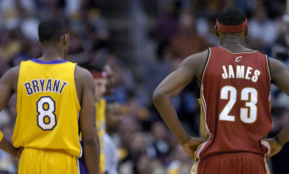 Kobe Bryant and LeBron James at the Staples Center on Jan. 12, 2004 in Los Angeles. - Credit: Kirby Lee/AP