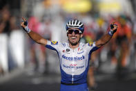 France's Julian Alaphilippe, celebrates as he crosses the finish line to win the second stage of the Tour de France cycling race over 186 kilometers (115,6 miles) with start and finish in Nice, southern France, Sunday, Aug. 30, 2020. Switzerland's Marc Hirschi finished second. (Stephane Mahe/Pool photo via AP)