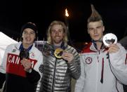 Men's snowboard slopestyle competition gold medalist Sage Kotsenburg of the U.S., silver medalist Staale Sandbech (R) of Norway and bronze medalist Mark McMorris (L) of Canada hold up their medals at the Olympic Park at the 2014 Sochi Olympic Games February 8, 2014. REUTERS/Morry Gash/POOL (RUSSIA - Tags: OLYMPICS SPORT SNOWBOARDING)