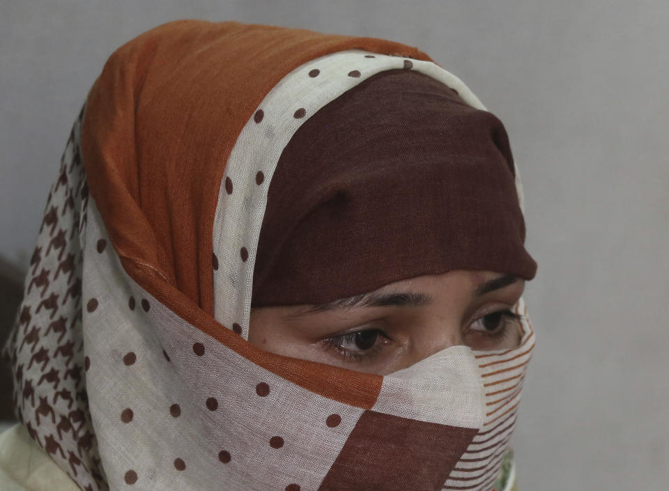 In this photo taken on May 22, 2019, Pakistani Christian girl Sumaira talks to the Associated Press in Gujranwala, Pakistan. Sumaira, who didn't want her full name used, was raped repeatedly by Chinese men at a house in Islamabad where she was brought to stay after her brothers arranged her marriage to an older Chinese man. Her father had died when she was young, her mother was poor and her brothers were offered money to marry her to a Chinese businessman. (AP Photo/K.M. Chaudary)