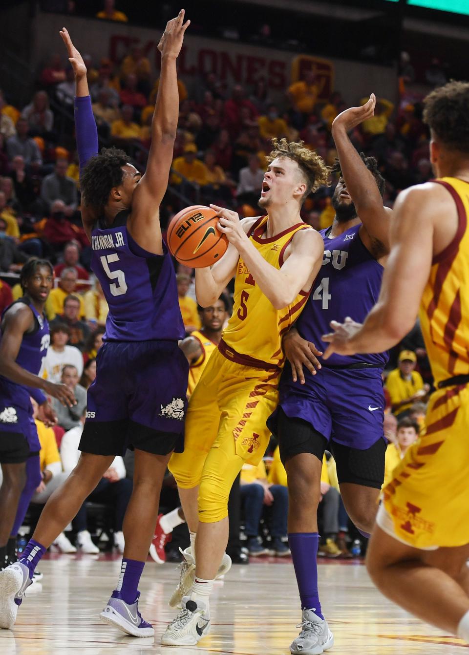 Iowa State Cyclones' forward Aljaz Kunc (5) looks for a shot between TCU Horned Frogs forward Chuck O'Bannon (5)   and Center Eddie Lampkin (4) during the second half at Hilton Coliseum Saturday, Jan. 22, 2022, in Ames, Iowa.