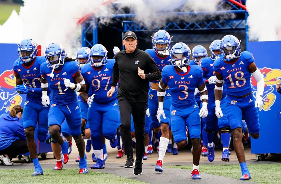 Oct 23, 2021; Lawrence, Kansas, USA; Kansas Jayhawks head coach Lance Leipold leads the team onto the field before the game against the Oklahoma Sooners at David Booth Kansas Memorial Stadium.