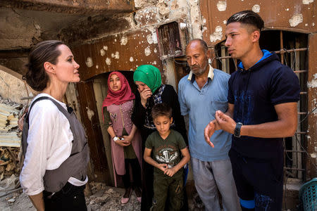 UNHCR Special Envoy Angelina Jolie meets with Mohamed and his family during a visit to the Old City in West Mosul, Iraq June 16, 2018. UNHCR/Andrew McConnell/Handout via REUTERS