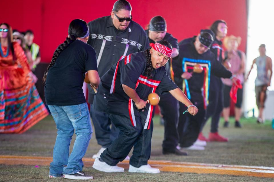 Joshoun Marruffo, 13, dances with fellow Desert Cahuilla Bird Singers at the Empire Polo Club during the Coachella Valley Music and Arts Festival in Indio, Calif., on Friday, April 14, 2023. 