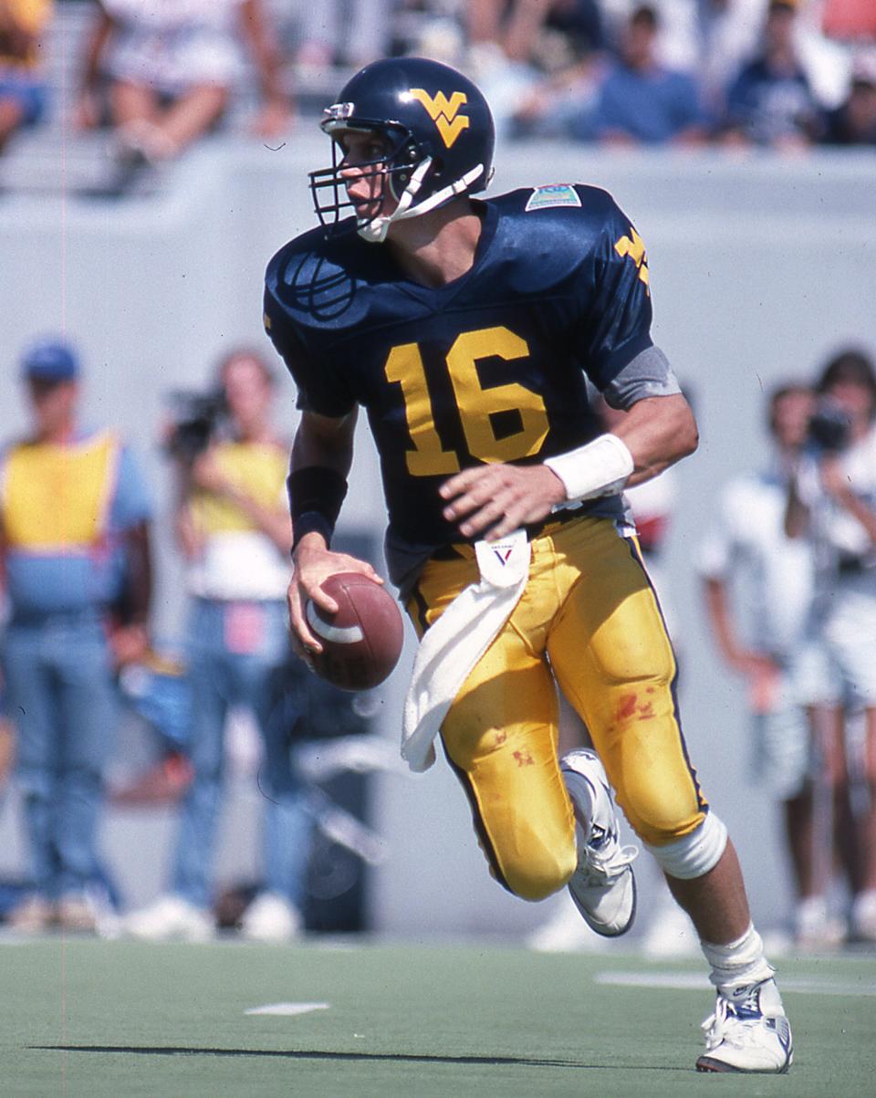 Chris Gray playing quarterback for West Virginia.