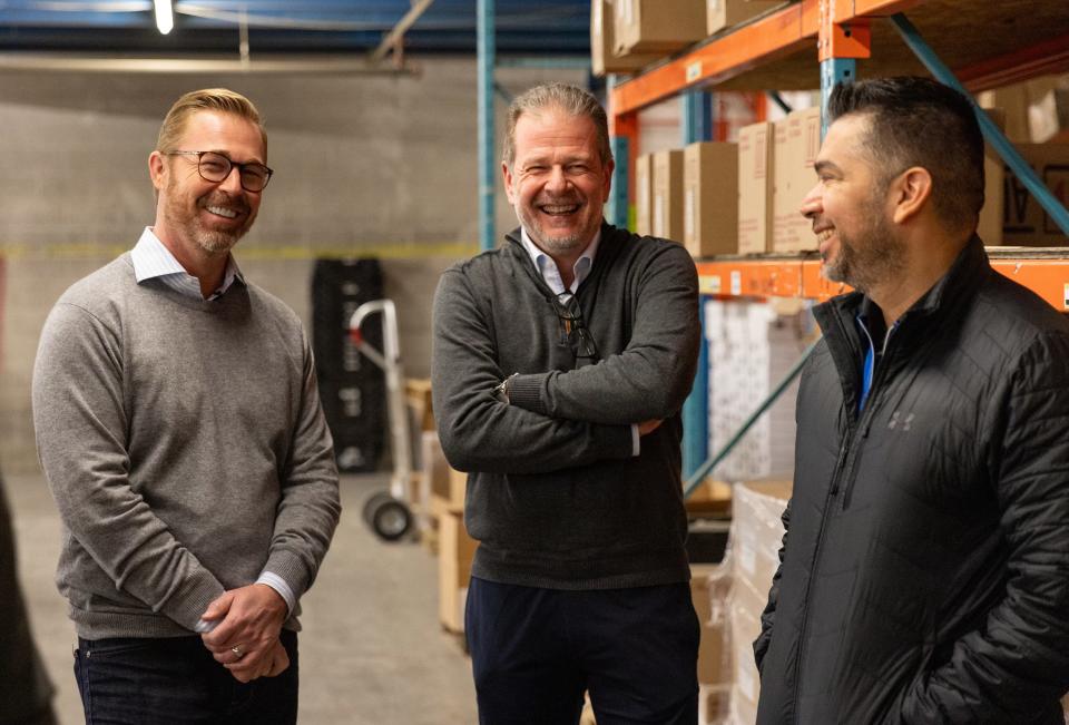 Brad Beckham, co-president of O’Reilly Auto Parts, Mauro Cifelli, president and CEO of Vast-Auto and Hugo Sanchez, vice president of O’Reilly Advertising and Marketing, tour a Vast-Auto distribution center.