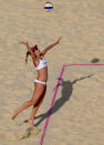 LONDON, ENGLAND - AUGUST 02: April Ross the United States serves during the Women's Beach Volleyball preliminary match between United States and Spain on Day 6 of the London 2012 Olympic Games at Horse Guards Parade on August 2, 2012 in London, England. (Photo by Ryan Pierse/Getty Images)