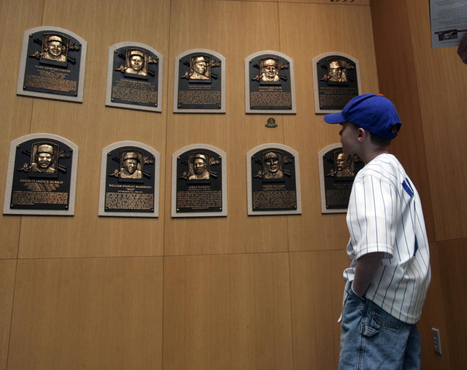 A young fan visits the plaque room at the National Baseball Hall of Fame in Cooperstown.