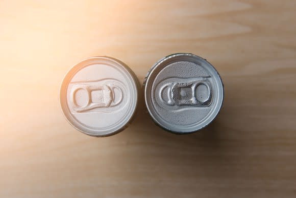 Two beverage cans facing each other